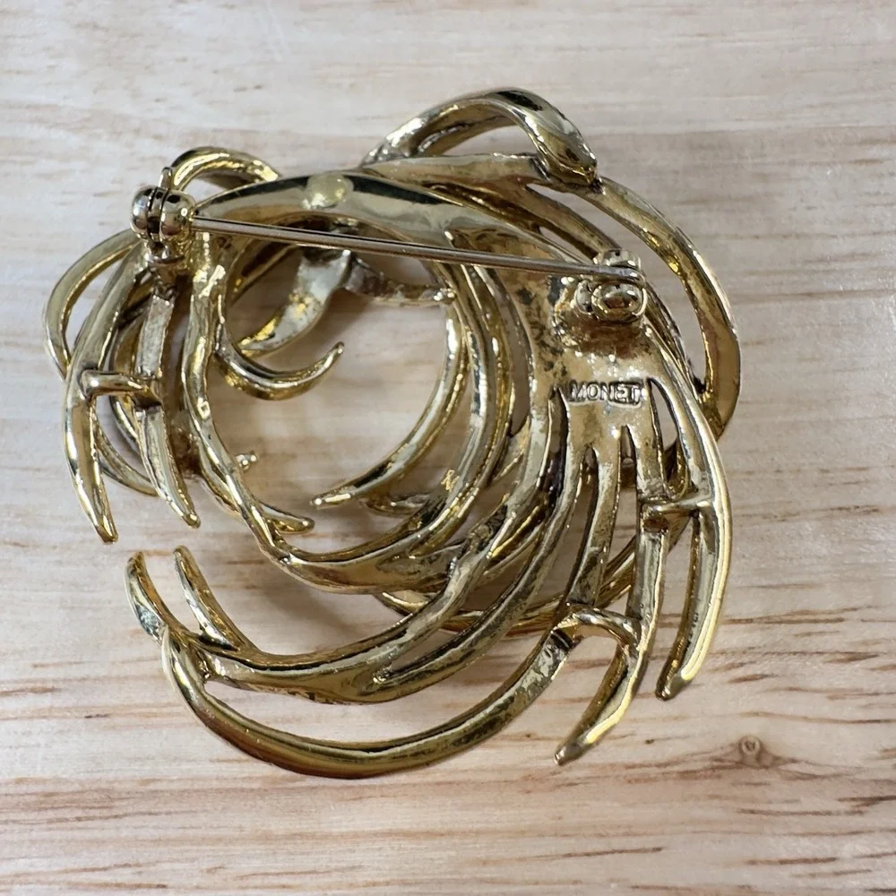 Vintage Monet Gold Tone Etched Swirl Rhinestone Brooch Signed BEAUTY